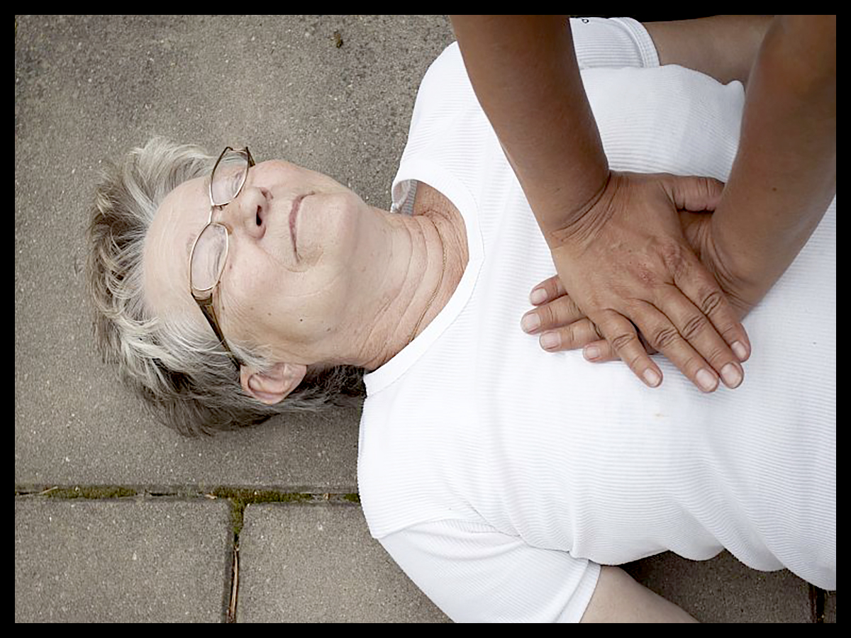an old woman receiving firs aid